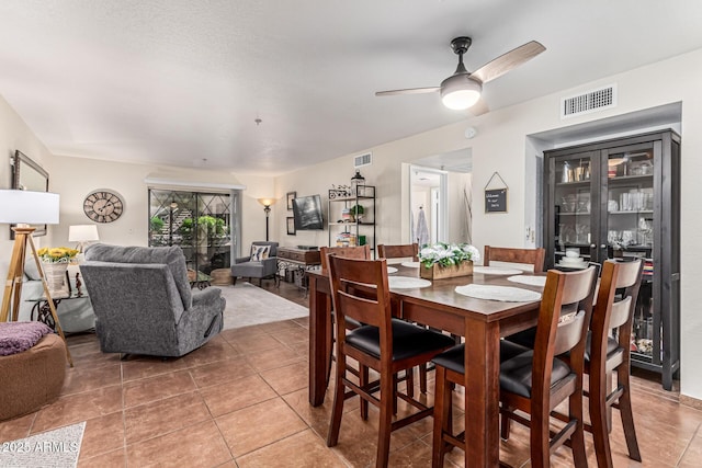 7777 E Main St Unit 143, Scottsdale, AZ 85251 - dining area with light tile patterned floors and a ceiling fan