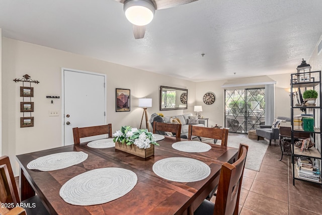 7777 E Main St Unit 143, Scottsdale, AZ 85251 - dining area featuring ceiling fan, tile patterned floors, and a textured ceiling