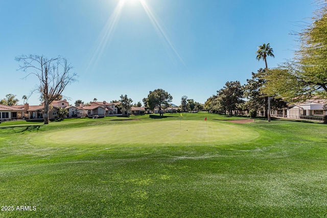 view of property's community with a lawn