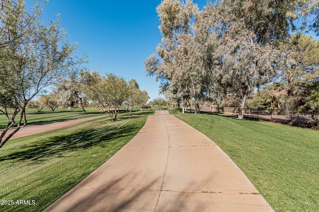 surrounding community featuring a yard