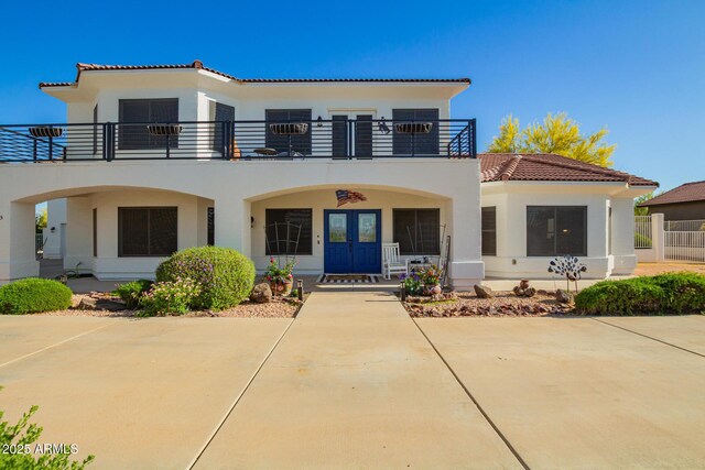 2075 W Silverlode Dr, Wickenburg, AZ 85390 - back of house with a balcony, a tile roof, and stucco siding
