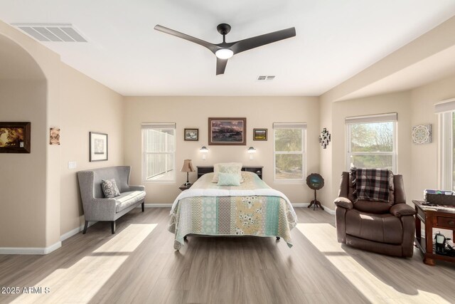 2075 W Silverlode Dr, Wickenburg, AZ 85390 - bedroom featuring light wood-style flooring, a ceiling fan, and baseboards