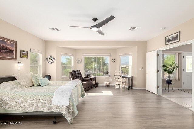 2075 W Silverlode Dr, Wickenburg, AZ 85390 - bedroom with multiple windows and wood finished floors