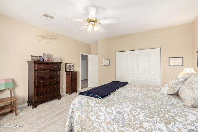 2075 W Silverlode Dr, Wickenburg, AZ 85390 - bedroom with a closet, light carpet, ceiling fan, and baseboards