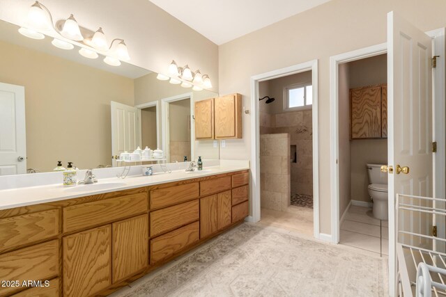2075 W Silverlode Dr, Wickenburg, AZ 85390 - bathroom featuring tiled shower, toilet, tile patterned flooring, and double vanity