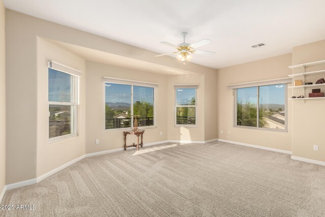 2075 W Silverlode Dr, Wickenburg, AZ 85390 - carpeted empty room featuring a ceiling fan and baseboards