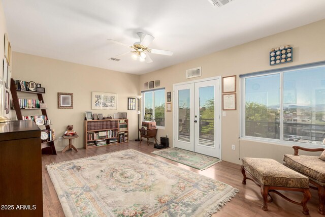 2075 W Silverlode Dr, Wickenburg, AZ 85390 - foyer with ceiling fan, wood finished floors, french doors, and plenty of natural light