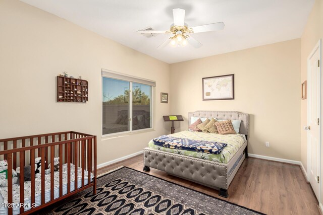 2075 W Silverlode Dr, Wickenburg, AZ 85390 - bedroom featuring baseboards, wood finished floors, and a ceiling fan