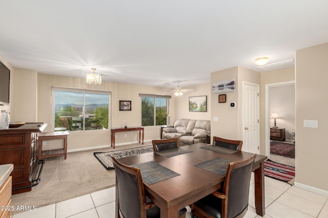 2075 W Silverlode Dr, Wickenburg, AZ 85390 - dining area featuring light tile patterned floors, light carpet, baseboards, and a chandelier