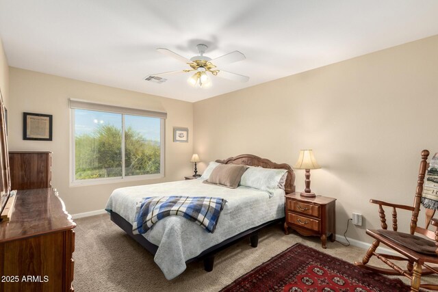 2075 W Silverlode Dr, Wickenburg, AZ 85390 - bedroom with light colored carpet, baseboards, and a ceiling fan