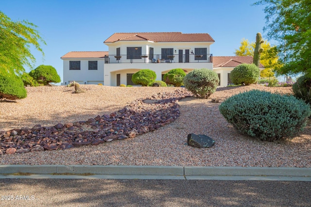 2075 W Silverlode Dr, Wickenburg, AZ 85390 - mediterranean / spanish house featuring a balcony, a tiled roof, and stucco siding