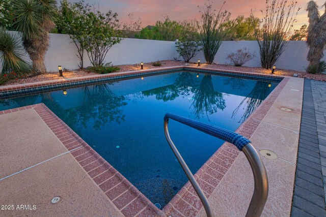 2075 W Silverlode Dr, Wickenburg, AZ 85390 - pool at dusk featuring a fenced backyard