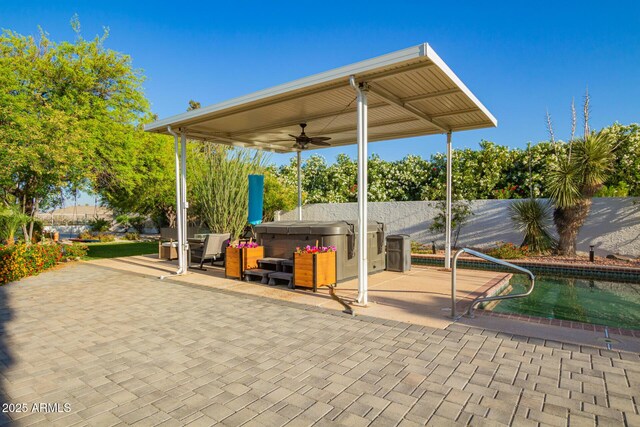 2075 W Silverlode Dr, Wickenburg, AZ 85390 - view of patio / terrace with a hot tub, a ceiling fan, and fence