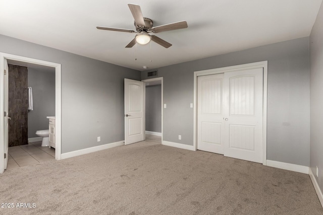 1747 W Devon, Mesa, AZ 85201 - unfurnished bedroom with carpet flooring, a closet, ensuite bathroom, and a ceiling fan