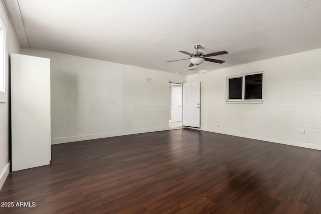 1747 W Devon, Mesa, AZ 85201 - spare room featuring dark wood-style flooring, brick wall, ceiling fan, and crown molding