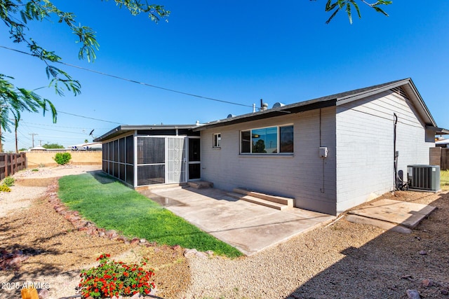 1747 W Devon, Mesa, AZ 85201 - back of property featuring a sunroom, brick siding, a fenced backyard, and a patio area