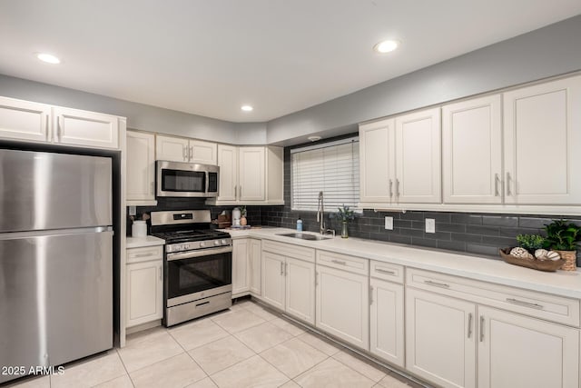 1747 W Devon, Mesa, AZ 85201 - kitchen featuring stainless steel appliances, light tile patterned floors, light countertops, tasteful backsplash, and recessed lighting