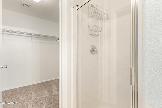 bathroom featuring an enclosed shower