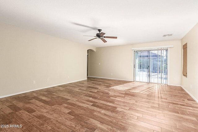 empty room with wood-type flooring and ceiling fan