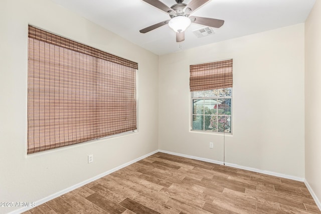 empty room featuring light hardwood / wood-style floors and ceiling fan