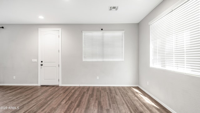 2668 N 73rd Gln, Phoenix, AZ 85035 - spare room featuring wood finished floors, baseboards, and recessed lighting