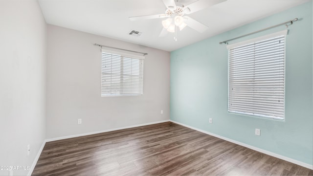 2668 N 73rd Gln, Phoenix, AZ 85035 - empty room with wood finished floors, a ceiling fan, and baseboards