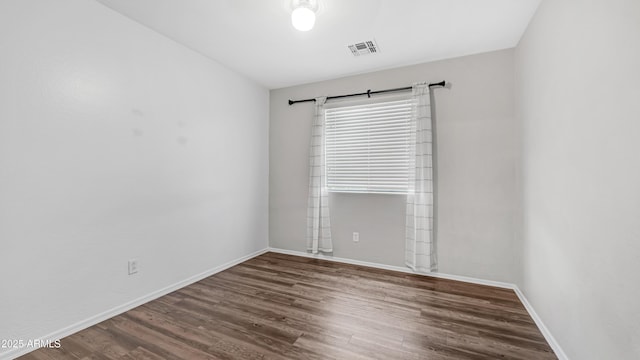 2668 N 73rd Gln, Phoenix, AZ 85035 - empty room with wood finished floors and baseboards