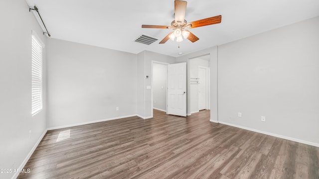 2668 N 73rd Gln, Phoenix, AZ 85035 - unfurnished bedroom featuring baseboards, wood finished floors, and a ceiling fan