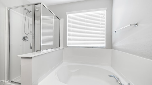 2668 N 73rd Gln, Phoenix, AZ 85035 - bathroom with a stall shower and a garden tub
