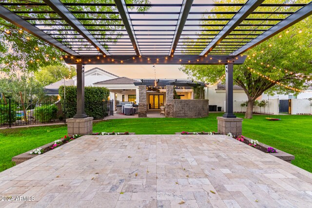 view of patio / terrace with area for grilling and a pergola