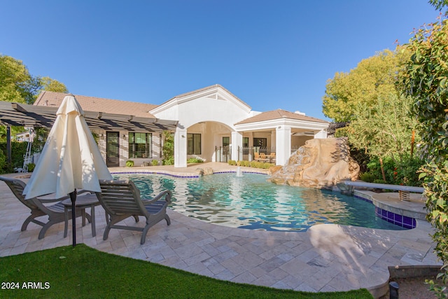 view of pool featuring a patio and pool water feature