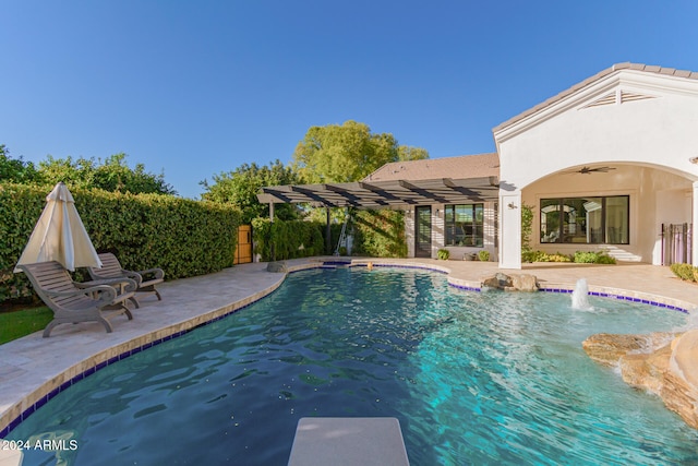 view of pool with a patio and pool water feature