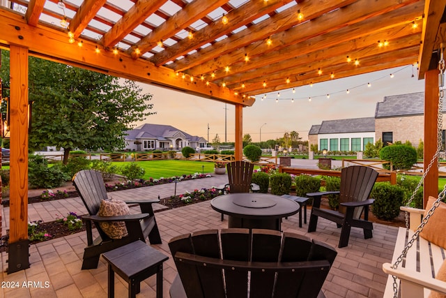 patio terrace at dusk with a pergola