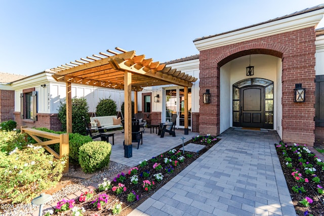 exterior space featuring an outdoor hangout area, a pergola, and a patio