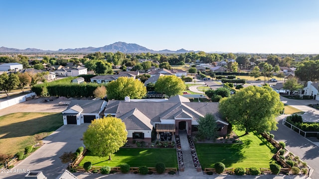 birds eye view of property with a mountain view