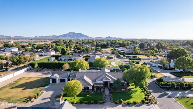 birds eye view of property with a mountain view