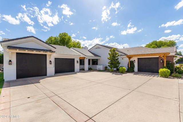 ranch-style house featuring a garage