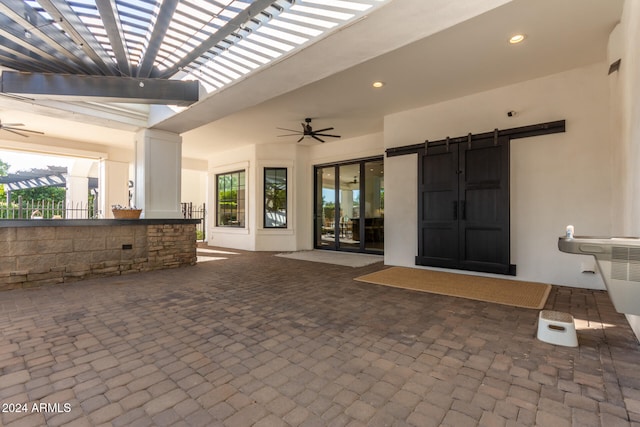 view of patio featuring ceiling fan and a pergola