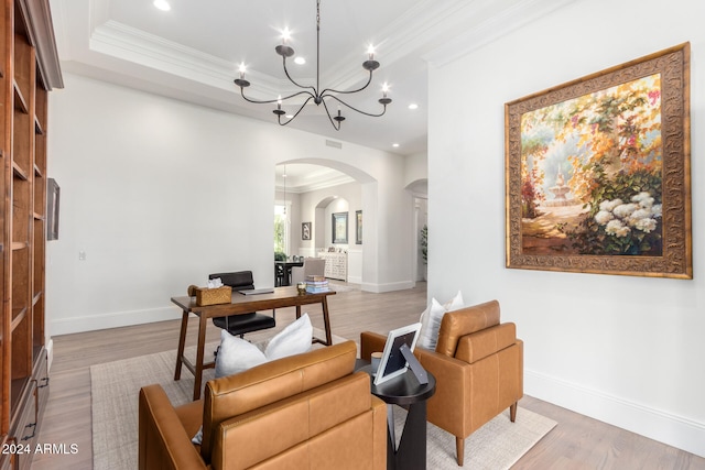 office area featuring light hardwood / wood-style floors, a notable chandelier, and ornamental molding