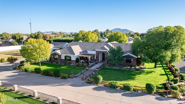 birds eye view of property featuring a mountain view