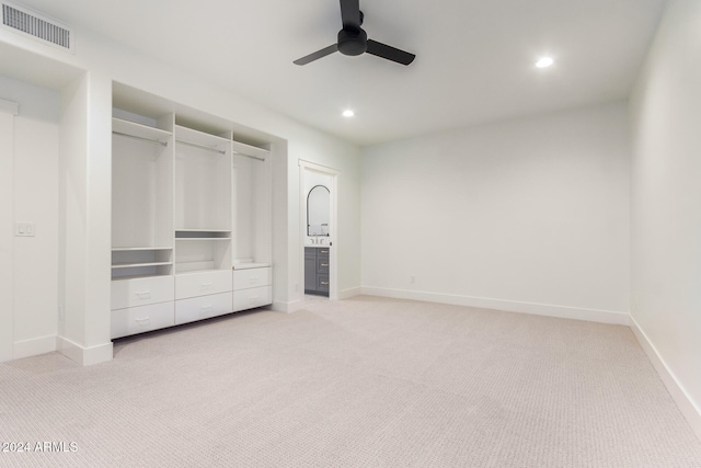 unfurnished bedroom with light carpet and ceiling fan