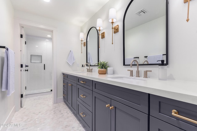 bathroom featuring vanity and a shower with door