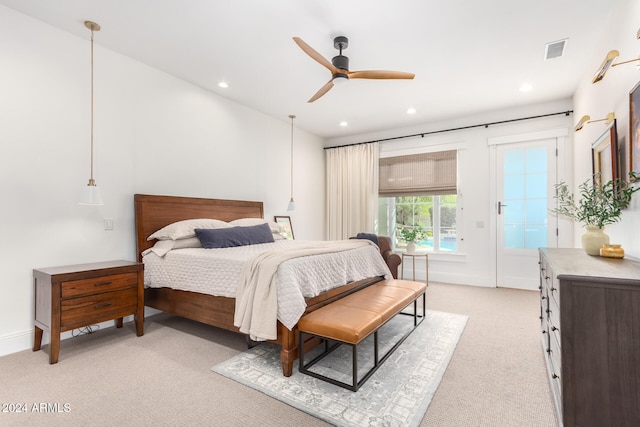 carpeted bedroom featuring ceiling fan and access to exterior