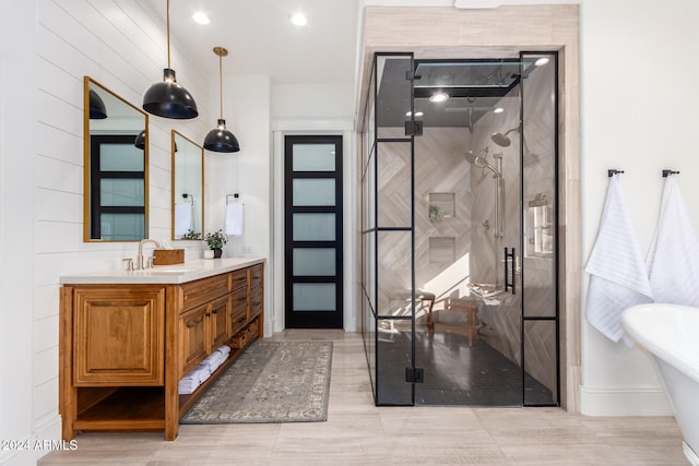 bathroom with independent shower and bath and vanity