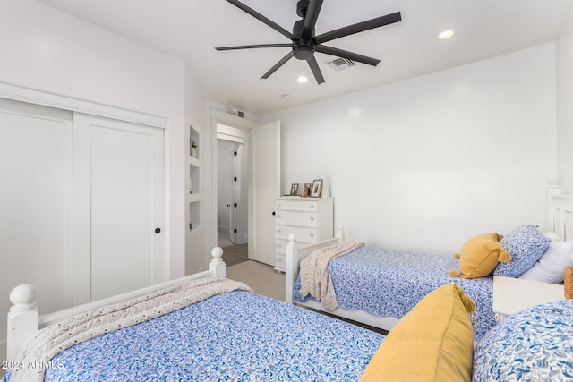 bedroom featuring a closet, carpet, and ceiling fan