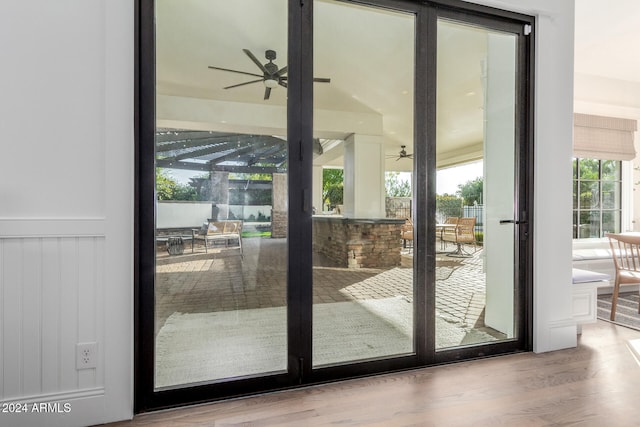 entryway with ceiling fan, wood-type flooring, and french doors