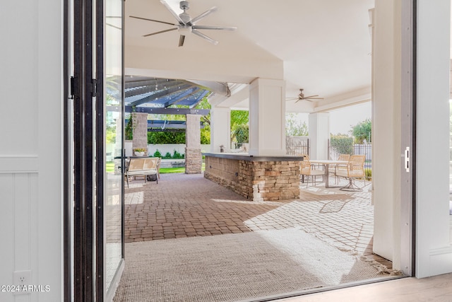 view of patio / terrace featuring ceiling fan