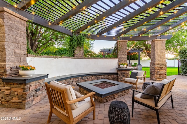 view of patio / terrace featuring an outdoor living space with a fire pit and a pergola