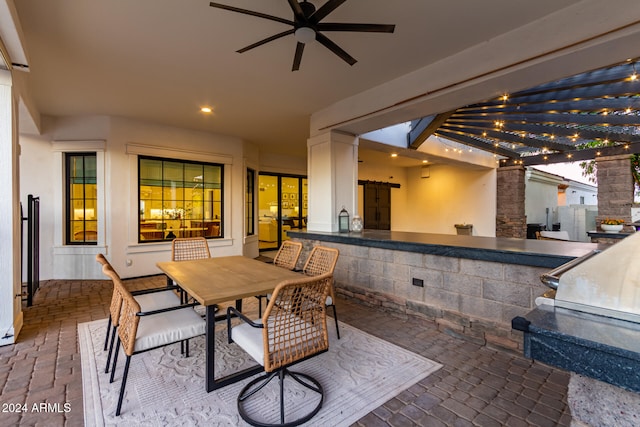 view of patio / terrace featuring a pergola and an outdoor kitchen