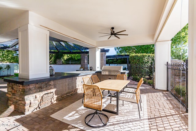 view of patio featuring ceiling fan and a grill